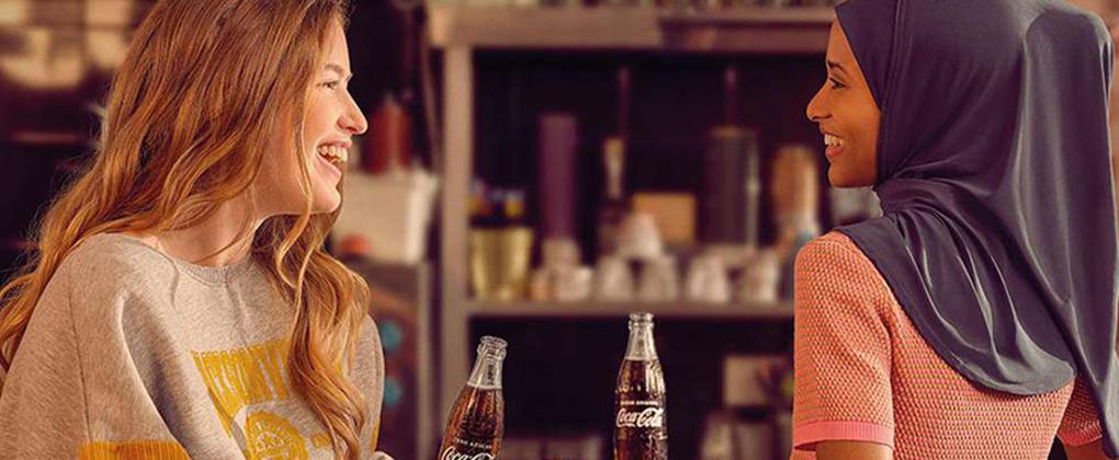 CCBA Consumer Wellbeing Two People Enjoying Coca Cola